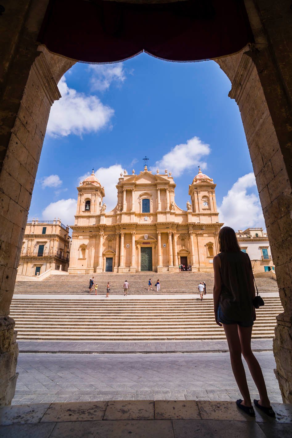 Tourist sightseeing at Duomo (Noto Cathedral, St Nicholas Cathedral, Cattedrale di Noto), a Baroque
